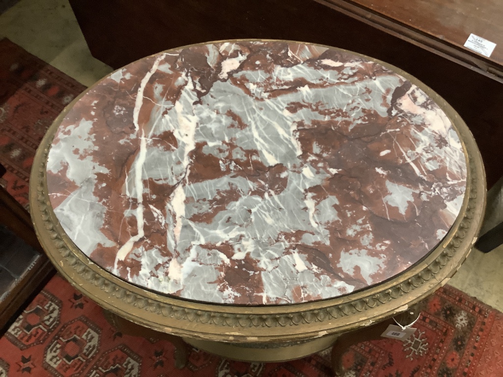 A French gilt marble topped oval table, width 56cm depth 43cm height 75cm